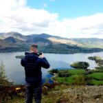 Panoramic view from Walla Crag in Keswick, overlooking Derwentwater, Skiddaw, and the surrounding Lake District fells